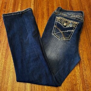 Women’s jeans with a lot of bling in the back by “Sexy Couture”